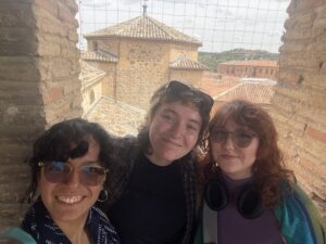 Gabby, Grace, and Sophie in front of the view from Iglesia del Salvador in Toledo, Spain