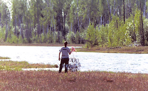 Lauren setting traps, Alaska, 2006. 