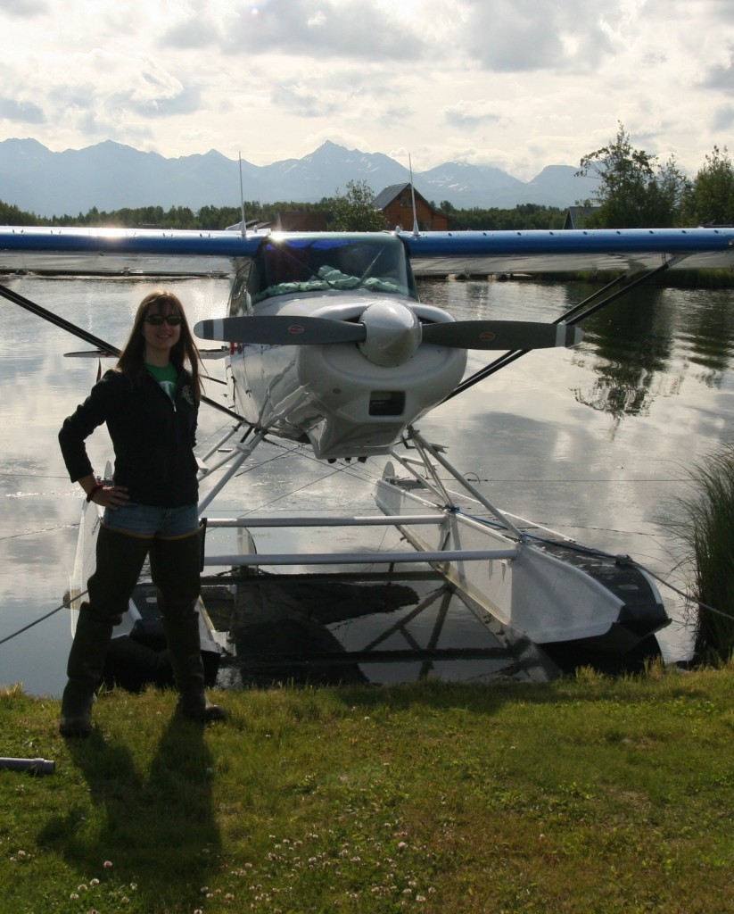 Sporting the latest fashion in hip waders - Rachel stands in front of Scott's float plane. It is lovingly referred to as "the baby."