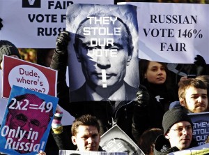 Russian residents in Britain demonstrate outside Britain's Houses of Parliament in London December 10, 2011. REUTERS/Luke MacGregor